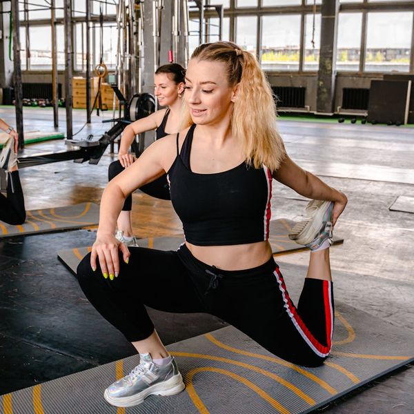 Smiling woman feeling energetic and balanced after a yoga session.